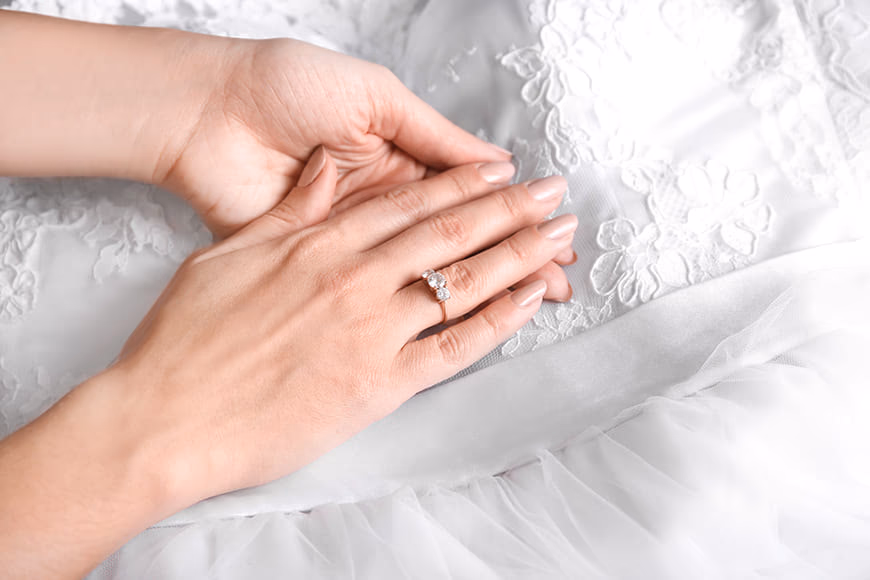Elegant jewelry staged minimally on polished stone slabs