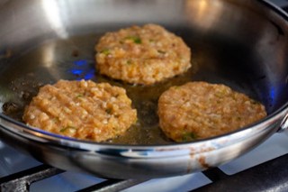 Chicken meatball sliders that have been crushed